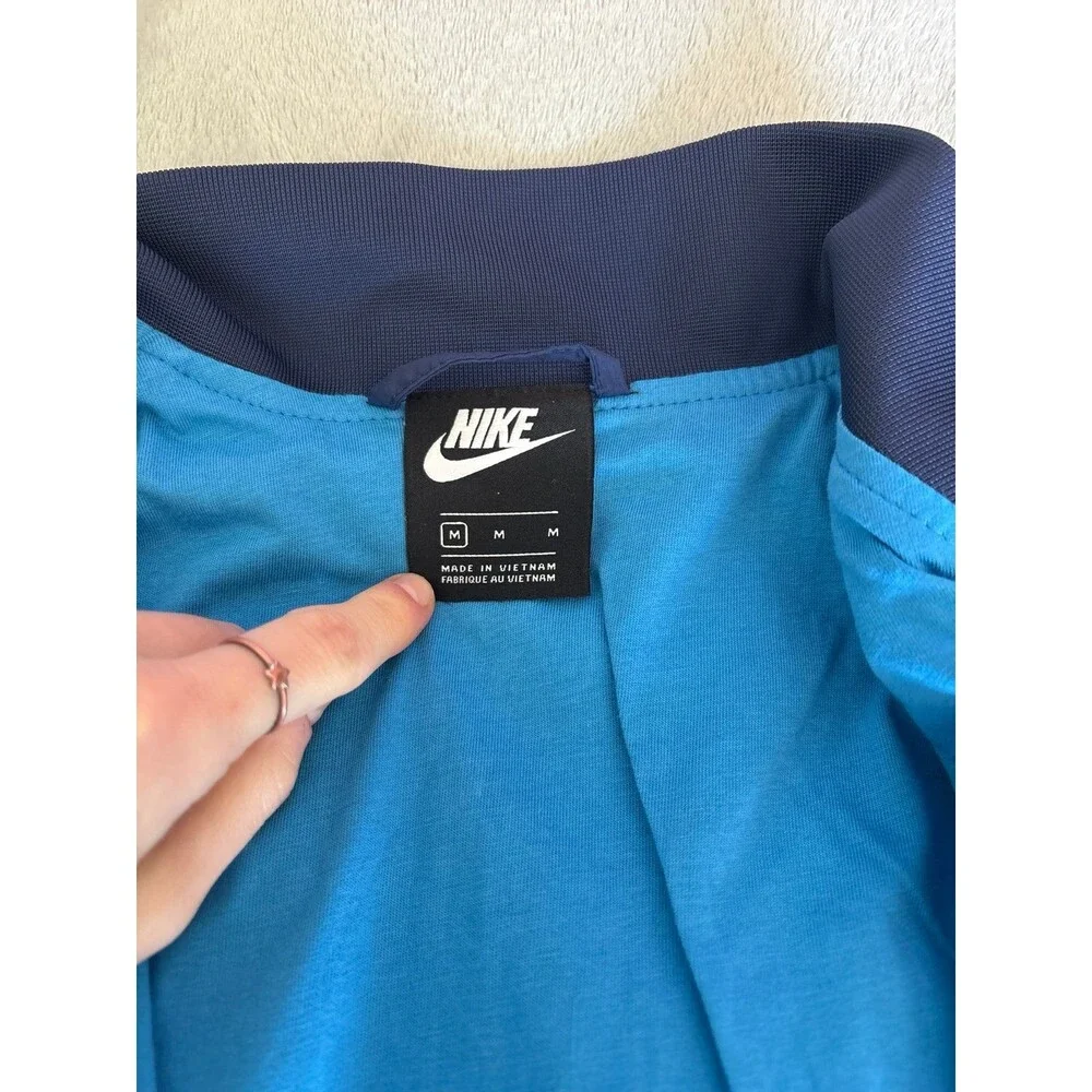 Women's Nike windbreaker rain jacket navy blue pockets Athletic sportswear NWOT